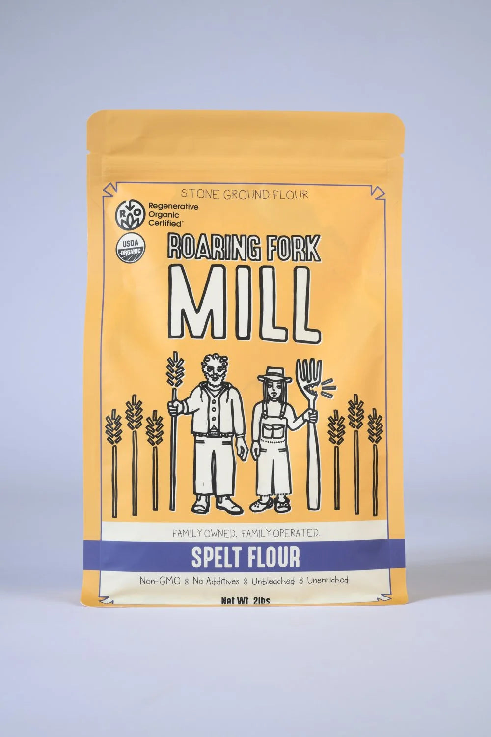 Package of Roaring Fork Mill spelt flour on a light gray background