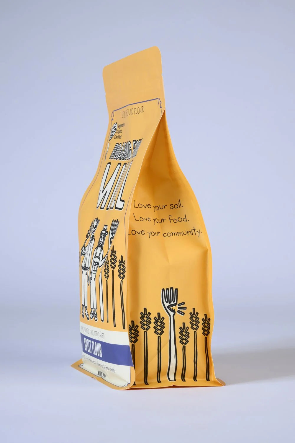 Yellow bag of flour with black illustrations and text on a light gray background